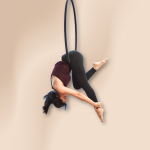 Thrilling and enjoyable acrobatic class, showcases strength and grace as performers execute dynamic movements suspended within a circular metal hoop with artistic flair and joy